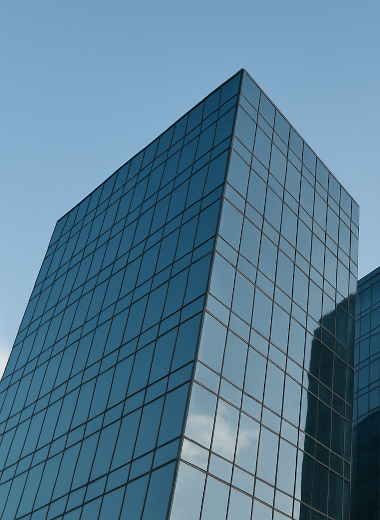 Modern office buildings with glass facades under a clear sky
